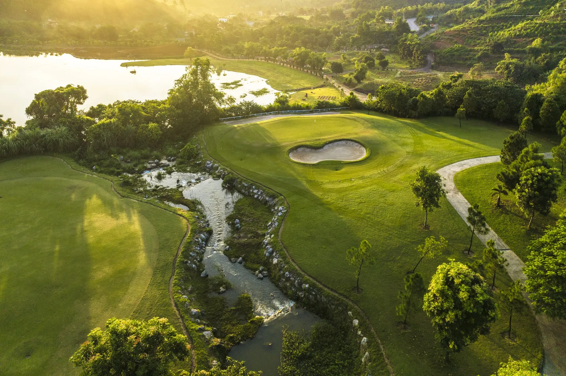 Trang An Golf & Resort - Champion Course amidst pine forest and Dong Chuong Lake